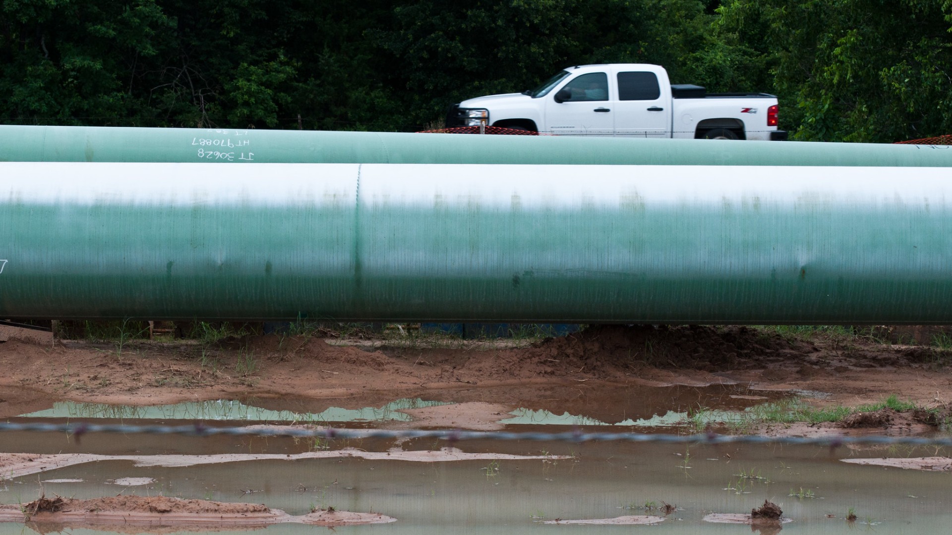 pipeline and pickup truck