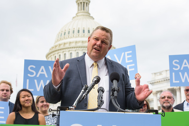 Tester standing at podium