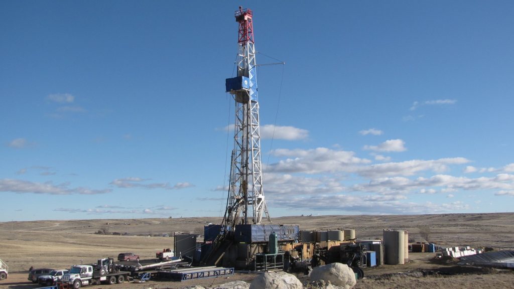 drilling rig and trucks