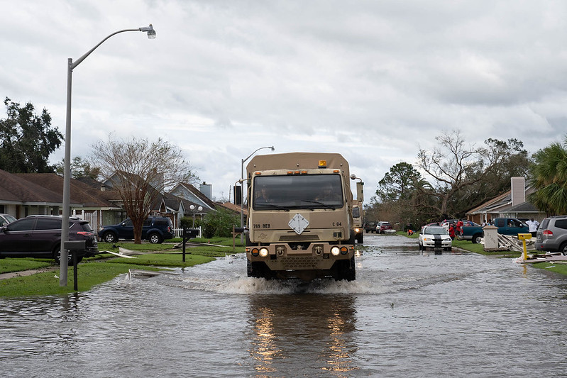 Truck driving flooded street