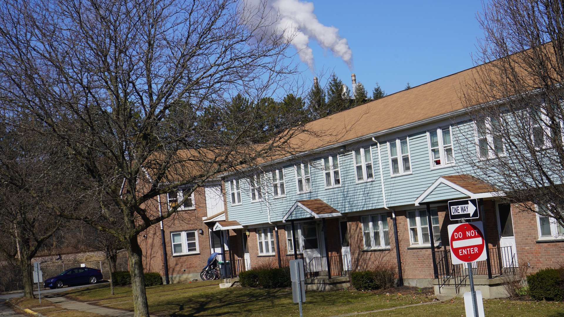 incinerator stack behind houses