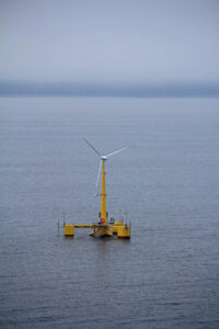 one floating turbine in gray sea
