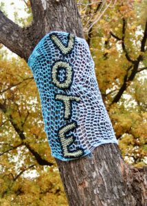 vote sign on a tree