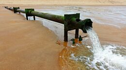sewer pipe outfall on beach