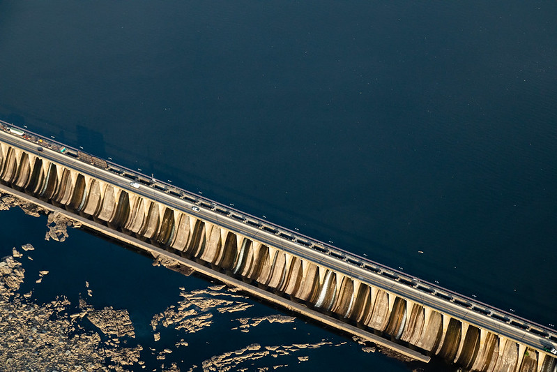 Aerial view of dam wall and reservoir