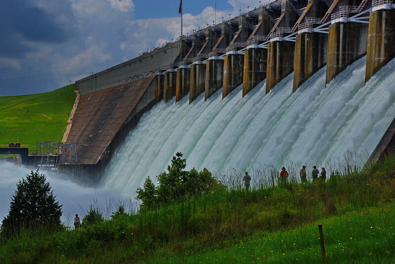 White water churning out of dam spillways.