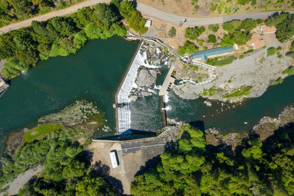 Aerial view of dam with fish ladder.