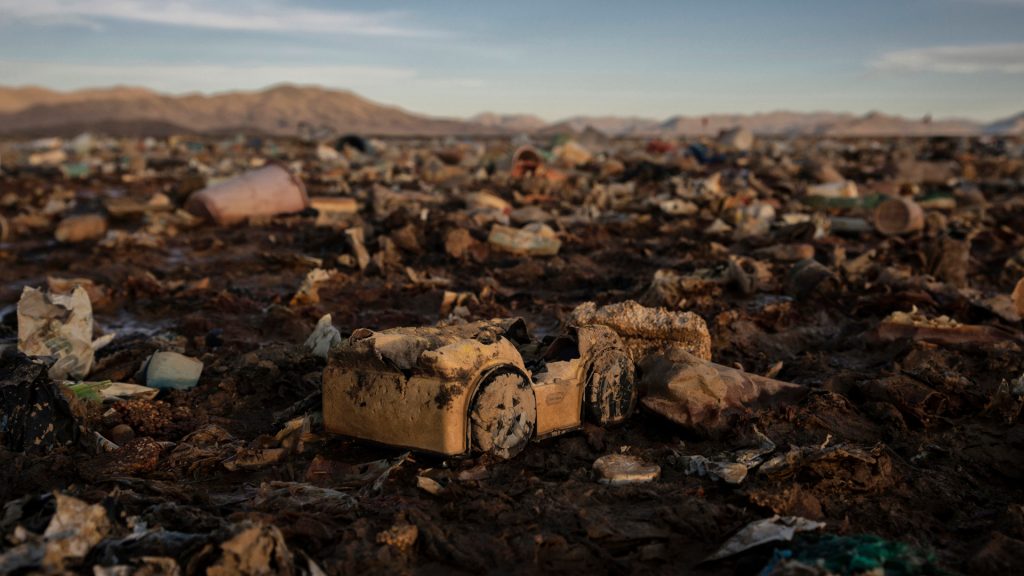 A toy truck and plastic debris scattered on mud along the Lake Uru Uru shore near Oruro, Bolivia, on April 8, 2021. In addition to a major drought in 2016 that dramatically decreased water levels, Lake Uru Uru has been devastated by plastic pollution and mining wasting.