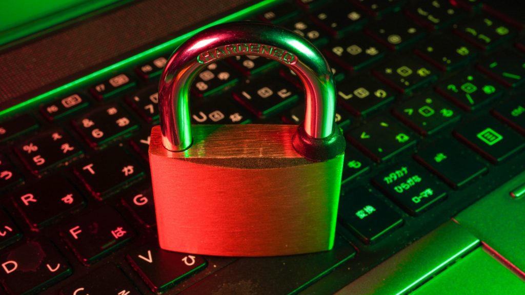 A padlock sitting on a computer keyboard