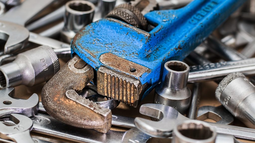 A wrench on a pile of other tools