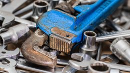 A wrench on a pile of other tools