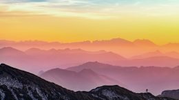 Misty mountains in the rising sun